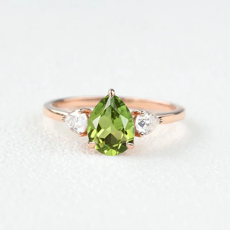 women's heart-shaped necklaces -Pear Shaped Peridot Three Stones Ring